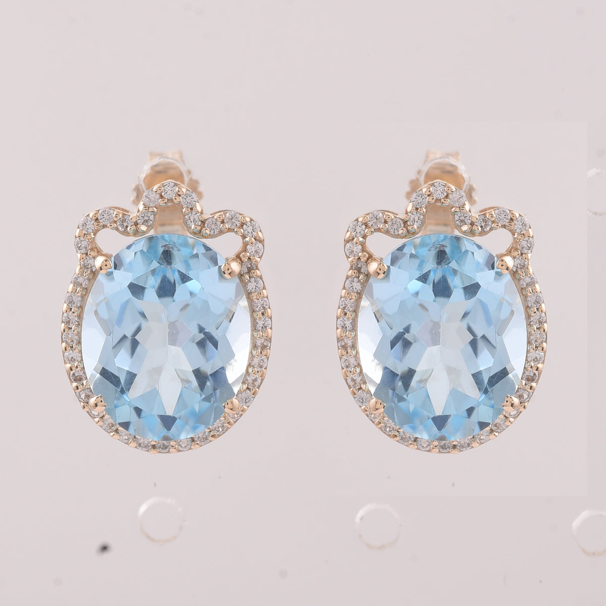 9.24 Ct Oval Blue Topaz 9K Gold Earrings