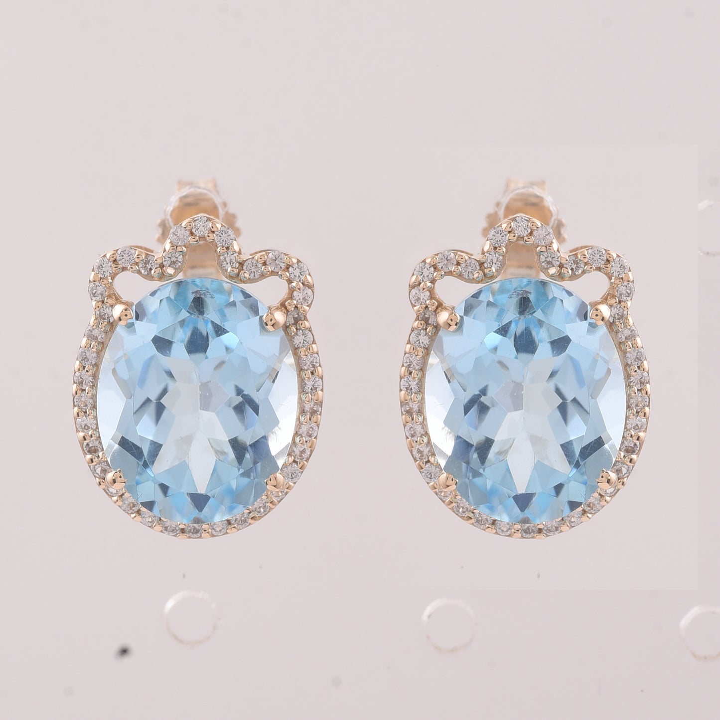 9.24 Ct Oval Blue Topaz 9K Gold Earrings