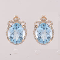 9.24 Ct Oval Blue Topaz 9K Gold Earrings