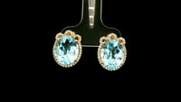9.24 Ct Oval Blue Topaz 9K Gold Earrings