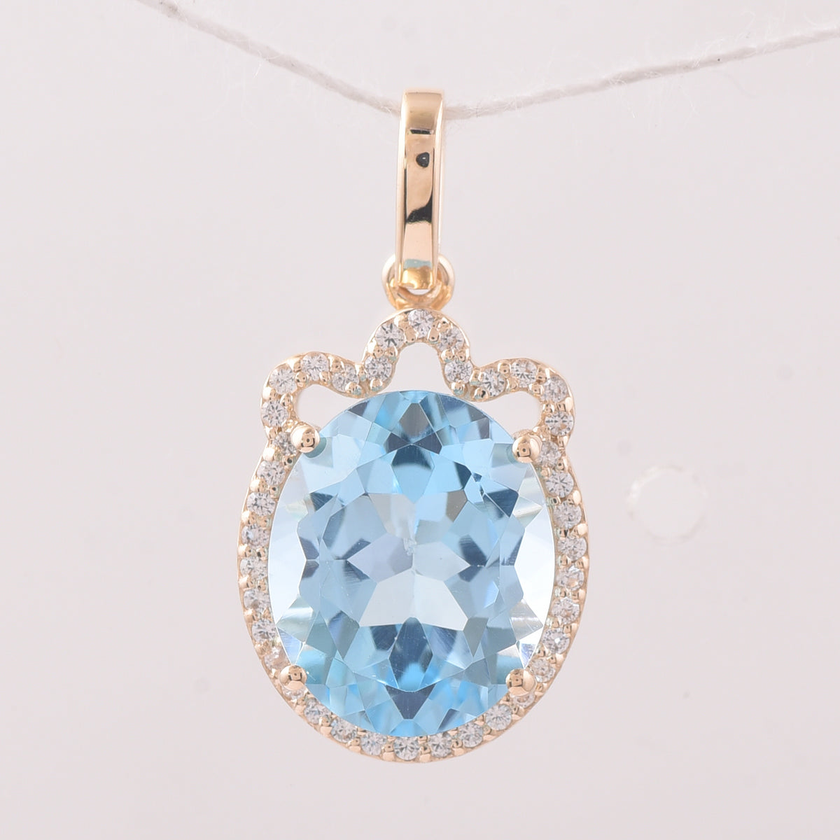 4.64 Ct Oval Blue Topaz 9K Gold Pendant