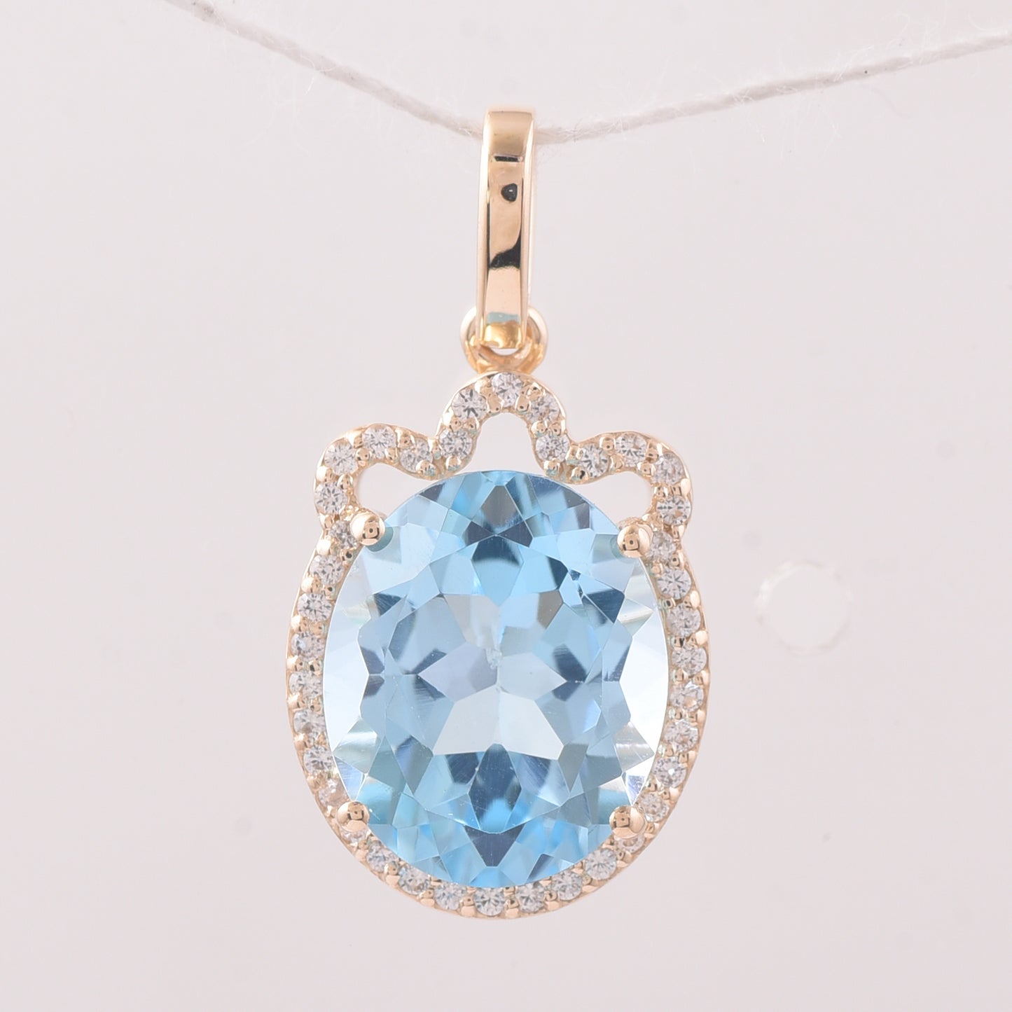 4.64 Ct Oval Blue Topaz 9K Gold Pendant