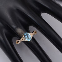 1.60 Ct Oval Blue Topaz 9K Gold Ring