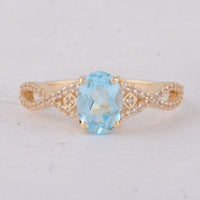 1.60 Ct Oval Blue Topaz 9K Gold Ring