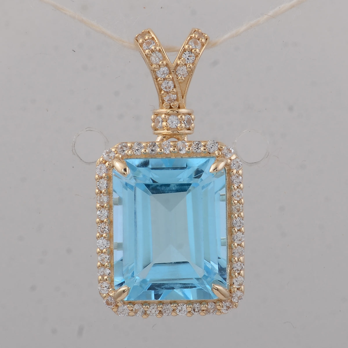 4.25 Ct Octagon Blue Topaz 9K Gold Pendant