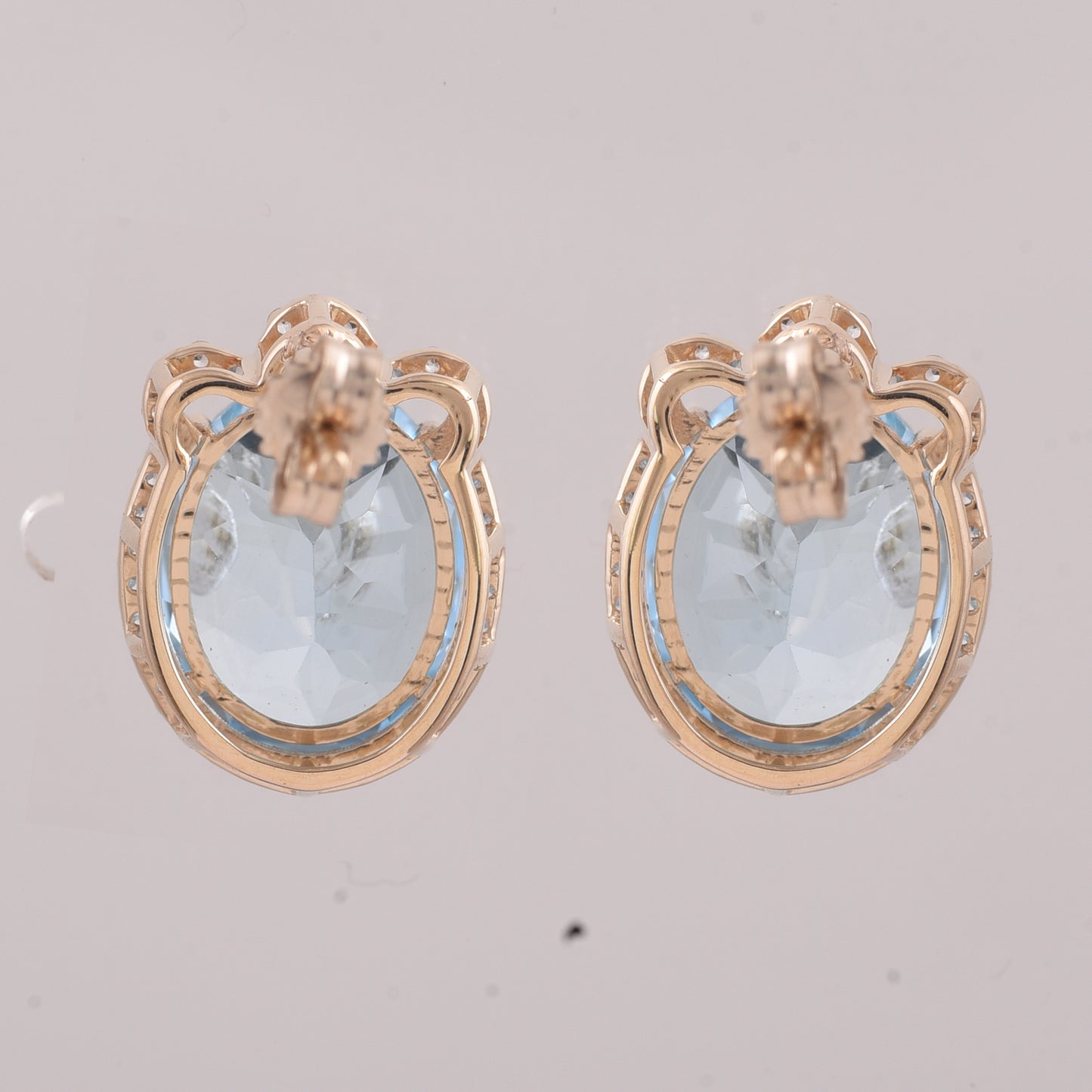 9.24 Ct Oval Blue Topaz 9K Gold Earrings