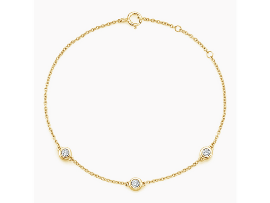 Radiant Trio 18K Yellow Gold Three Diamond Bezel Bracelet 1/6 ctw