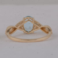 1.60 Ct Oval Blue Topaz 9K Gold Ring
