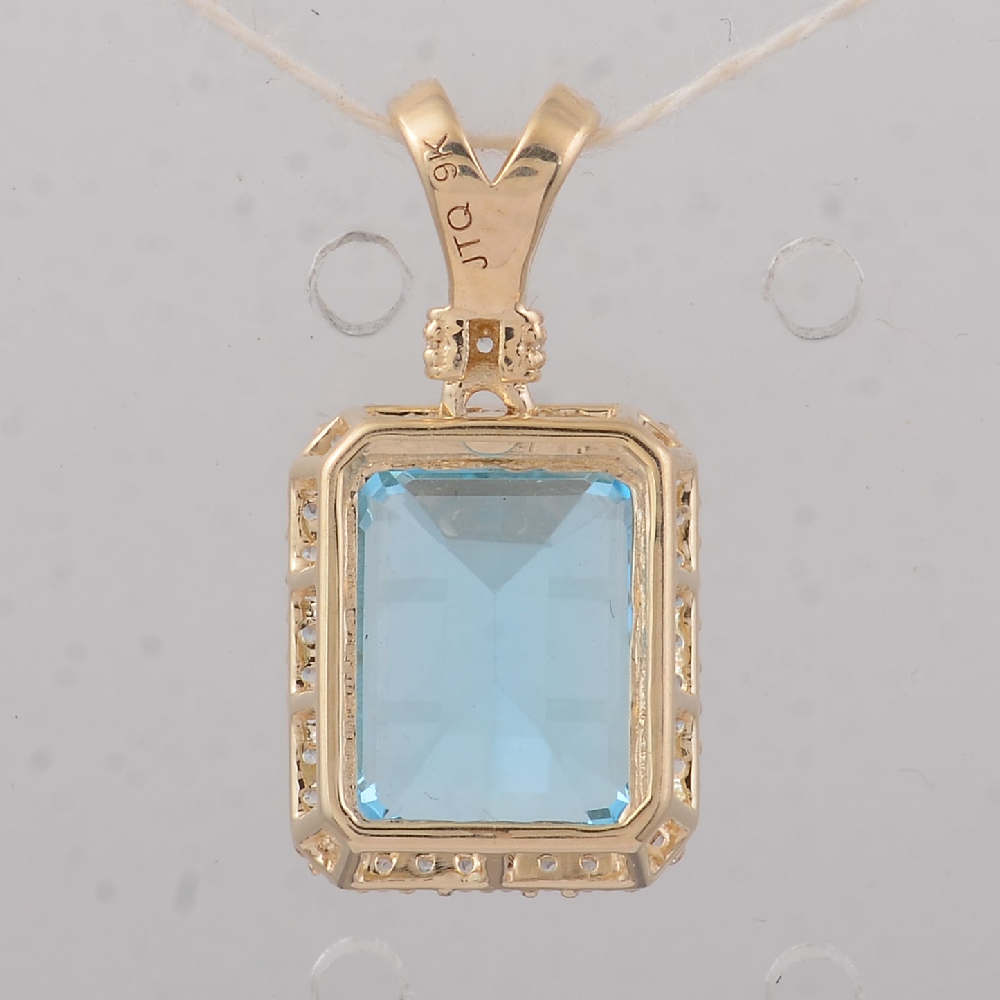 4.25 Ct Octagon Blue Topaz 9K Gold Pendant